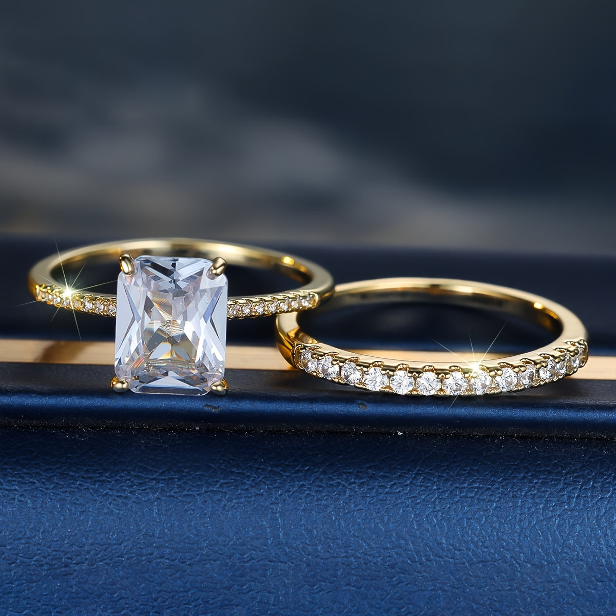 A set of square white Zirconia rings, a two-piece Women's fashion set, and jewelry suitable for holiday parties.