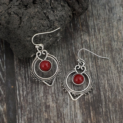 Retro-style silver synthetic gemstone stud earrings, zinc alloy iron earrings, elegant hollow design, suitable for daily wear