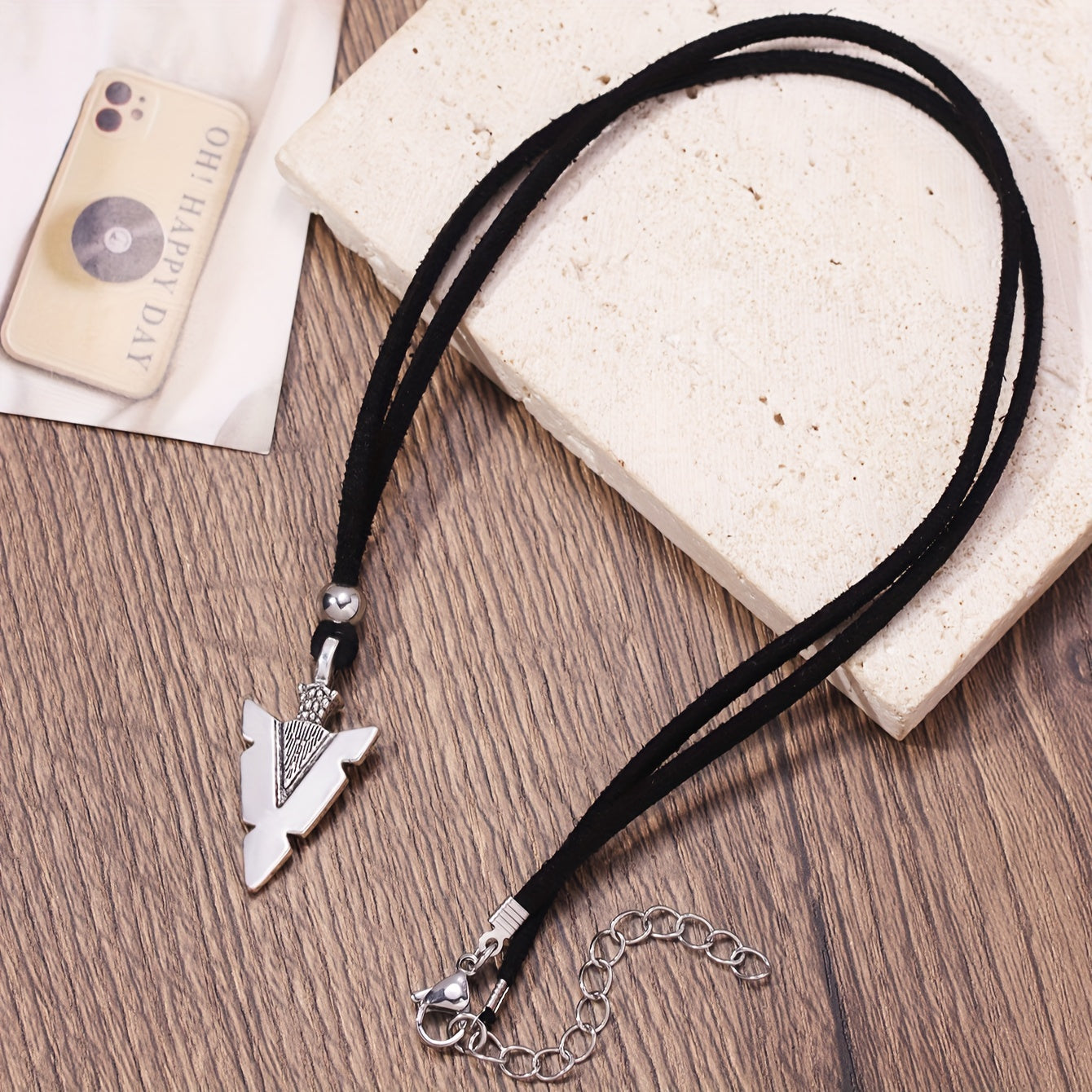 Men's casual accessories, a punk triangular arrow pendant, black rope necklace.