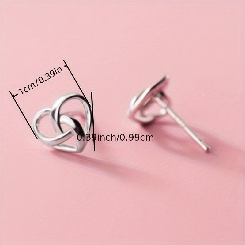 Hollow silver heart-shaped buckle stud earrings, cute and simple style, copper and silver plated jewelry, suitable for daily casual wear
